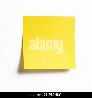 Yellow sticky note isolated on white background, front view adhesive paper with copy space Stock Photo