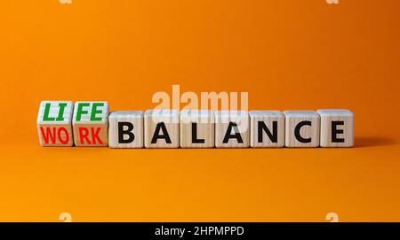 Work life balance symbol. Turned wooden cubes and changed concept words ...