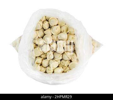 Meat dumplings, ravioli, a lot homemade Russian pelmeni in open package isolated on white with clipping path Stock Photo