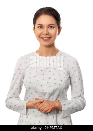 Smiling woman standing over white background Stock Photo