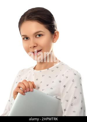 Smiling woman holding closed laptop computer Stock Photo