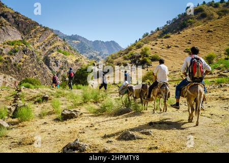 August 25, 2016, Shirkent, Tajikistan: A group of tourists and local guides on a trail in Hissar Valley in Tajikistan Stock Photo