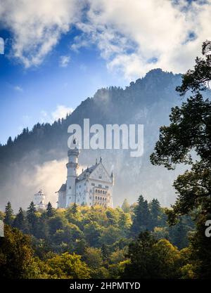 Scenic view of the Neuschwanstein Castle in morning fog Stock Photo