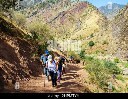 August 25, 2016, Shirkent, Tajikistan: A group of tourists on a trail in Hissar Valley in Tajikistan Stock Photo