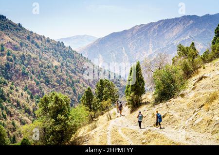 A group of tourists on a trail in Shirkent Valley in Tajikistan Stock Photo