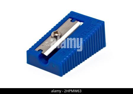 Close up of a blue single hole plastic pencil sharpener, branded Staedtler, isolated against a white background. Stock Photo