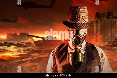 Portrait photo of post apocalyptic male citizen in formal outfit, hat and gas mask standing on destroyed city nuclear war wasteland. Stock Photo