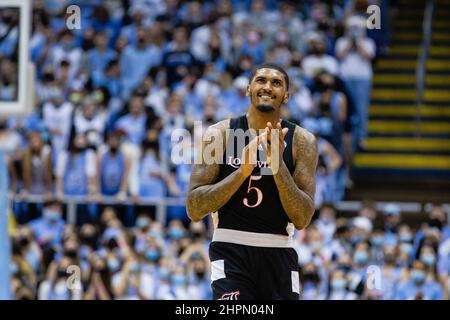 Chapel Hill, NC, USA. 21st Feb, 2022. Louisville Cardinals forward Malik Williams (5) celebrates as they retake the lead during the second half of the ACC basketball matchup at Dean Smith Center in Chapel Hill, NC. (Scott Kinser/Cal Sport Media). Credit: csm/Alamy Live News Stock Photo