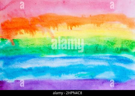 Hand painted abstract watercolor background on paper in rainbow colors, paint streaks Stock Photo