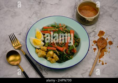 Gado gado or mixed vegetables with peanut sauce is a traditional salad ...