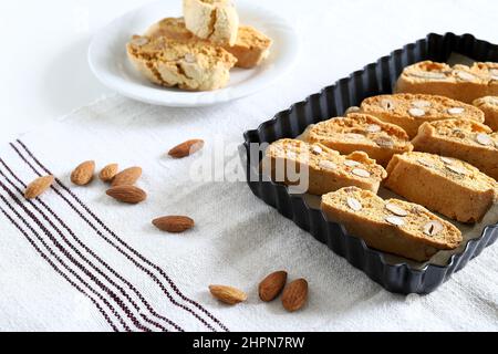 Cantucci, traditional Italian almond cookies from Tuscany on white background. Stock Photo