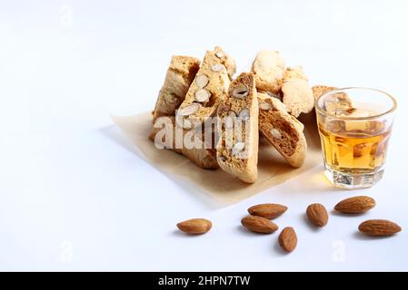 Cantucci, Italian almond cookies with sweet wine Vin Santo isolated on white background. Stock Photo