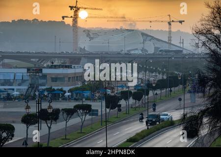 An opera house is under construction as a public transit train tramway passes in Rabat, Morocco, north Africa. Stock Photo