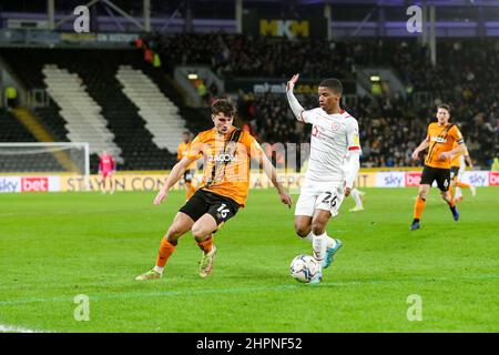 Kingston Upon Hull, UK. 22nd Feb, 2022. Barnsley's REmy Vita (26) shields the ball from Hull City's Ryan Longman (16) during the EFL Sky Bet Championship match between Hull City and Barnsley at the KCOM Stadium, Kingston upon Hull, England on 22 February 2022. Photo by Simon Hall. Editorial use only, license required for commercial use. No use in betting, games or a single club/league/player publications. Credit: UK Sports Pics Ltd/Alamy Live News Stock Photo