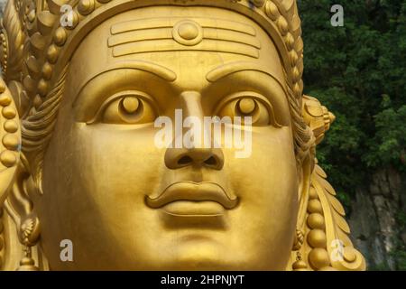 Detail close up of Murugan Statue (Tugu Dewa Murugga) in Batu Caves, Selangor, Kuala Lumpur. Tallest statue of a Hindu deity in Malaysia Stock Photo