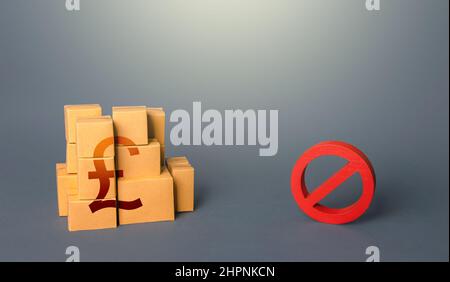 British pound sterling goods boxes and prohibition symbol NO. Ban on import goods. Impossibility of transportation, oversupply. Sanctions and embargoe Stock Photo