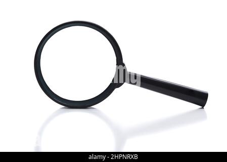 Magnifying glass isolated on white with reflection. Stock Photo