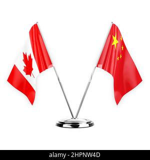 Two table flags isolated on white background 3d illustration, canada and china Stock Photo