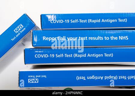 Stack of boxes of COVID-19 Self Test, Rapid Antigen Test kits supplied by NHS England UK Stock Photo