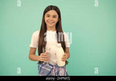 happy kid going to drink glass of milk or yoghurt, diary product Stock Photo