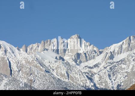 Mount Whitney in The Eastern Sierra Nevada Mountains California  is the highest mountain in the contiguous United States at 14,505 feet (4,421 m). Stock Photo