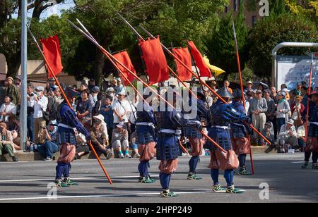 Nagoya, Japan - October 20, 2019: Participants of autumn Nagoya festival wearing the historical costumes of warriors (Ashigaru) of feudal lord army of Stock Photo
