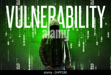 Faceless hacker with inscription Stock Photo