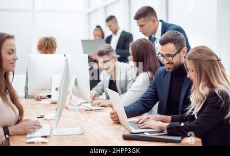 professional employees work on computers in a modern office. photo with copy space Stock Photo