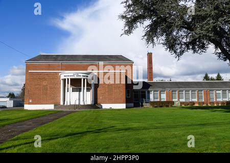 Monroe, WA, USA - February 21, 2022; Wagner Performing Arts Center in Monroe Washington with the chimney used as a root by Vaux Swifts Stock Photo