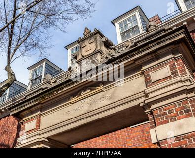 Cambridge, Massachusetts, USA - February 19, 2022: Harvard University's Dexter Gate between Massachusetts Avenue and Harvard Yard. Stock Photo