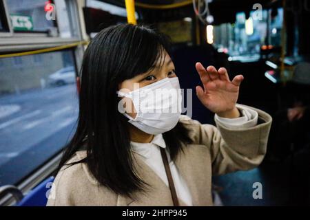 San Francisco, United States. 21st Feb, 2022. Yanni Ho seen in a bus in San Francisco. Yanni Ho, a 18 year old girl who comes from Hong Kong was a suspect of Hong Kong Police force since the national security law. Ho had been arrested twice by national security department of Hong Kong Police in 2020, she decided to leave Hong Kong in 2021 and moved to the United States to ensure her safety. Credit: SOPA Images Limited/Alamy Live News Stock Photo