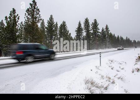 Reno, United States. 22nd Feb, 2022. Cars drive up a mountain road. Winter road conditions worsen as snow falls in the mountains. Chains where required on all vehicles except 4-Wheel drive with snow tires. (Photo by Ty O'Neil/SOPA Images/Sipa USA) Credit: Sipa USA/Alamy Live News Stock Photo