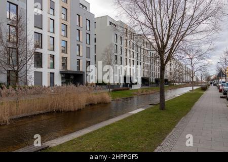 Street scene with a small river of the new 'Bahnstadt' district in Heidelberg Stock Photo
