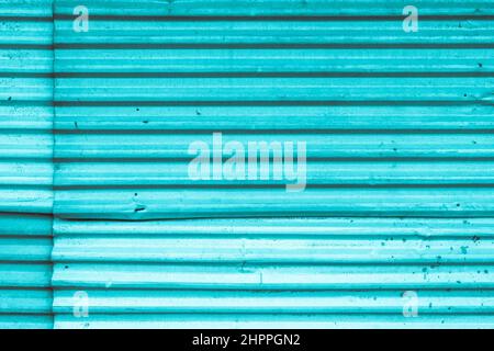 Blue colored metal store front iron curtain texture background Stock Photo