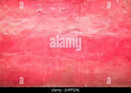 Pink colored grunge cement wall texture background. Stock Photo
