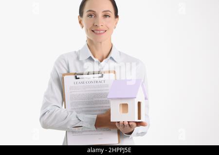 Realtor agent holding house and lease contract closeup Stock Photo