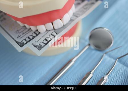 Artificial teeth in fake dentures. Dentist instruments for healthcare Stock Photo