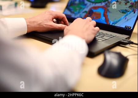 Karlsruhe, Germany. 01st Feb, 2022. At the kr3m company, one person works on a laptop. Among other things, the company deals with gamification. (to dpa 'Winning customers and employees by playing games - gamification is everyday life') Credit: Uli Deck/dpa/Alamy Live News Stock Photo