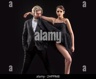 Salsa dancing couple. Young luxury pair dance isolated on black background. Romantic Stock Photo