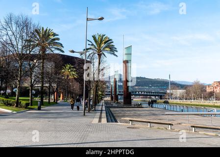 Bilbao, Spain - February 13, 2022: View of the promenade along the estuary of Bilbao. Stock Photo