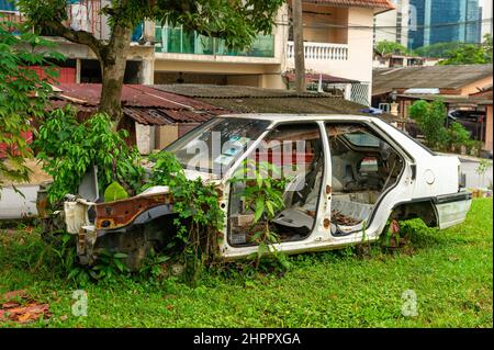 Abandoned Proton Car at Kampung Baru, Kuala Lumpur Stock Photo