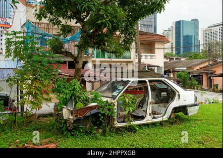 Abandoned Proton Car at Kampung Baru, Kuala Lumpur Stock Photo