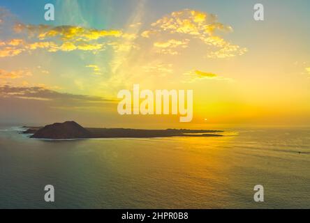 Beautiful panoramic view of the sunrise over the island of Lobos near Corralejo Fuerteventura Stock Photo