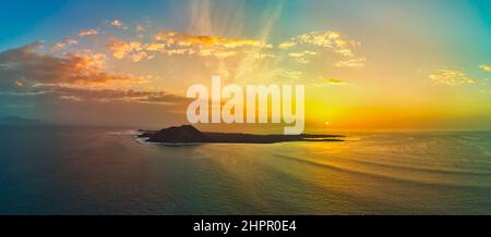 Beautiful panoramic view of the sunrise over the island of Lobos near Corralejo Fuerteventura Stock Photo