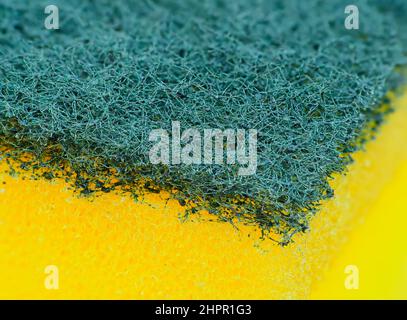 Extreme close-up of a kitchen sponge, with yellow and green color Stock Photo