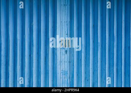 Store front metal iron curtain texture background. Roll up metal blinds background. Stock Photo
