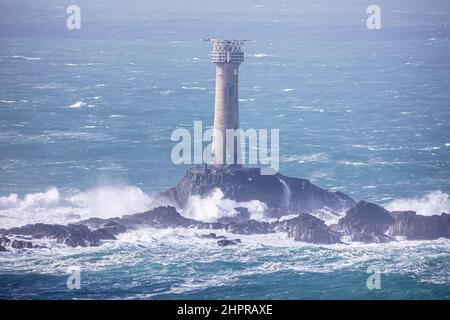 Longships Lighthouse, Lands End, Cornwall.  Photographed during a brisk north westerly gale at low tide Stock Photo