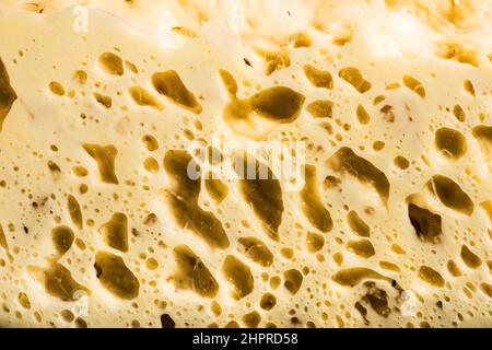 the natural yeast rises and creates bubbles in the dough Stock Photo