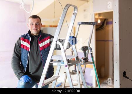 Repair man looking at camera and smiling Stock Photo