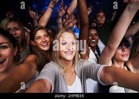 Attractive female fans enjoying a concert- This concert was created for ...